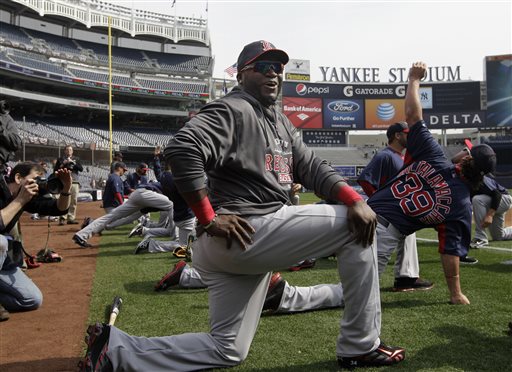 Boston Red Sox designated hitter David Ortiz jokes with reporters on the field before the Red Sox Opening Day baseball game against the New York Yankees at Yankee Stadium in New York on Monday.