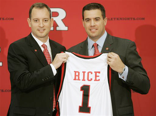 In this May 6, 2010, photo, Rutgers University Athletic Director Tim Pernetti, right, presents Mike Rice with a jersey after introducing Rice as the new men's head basketball coach.