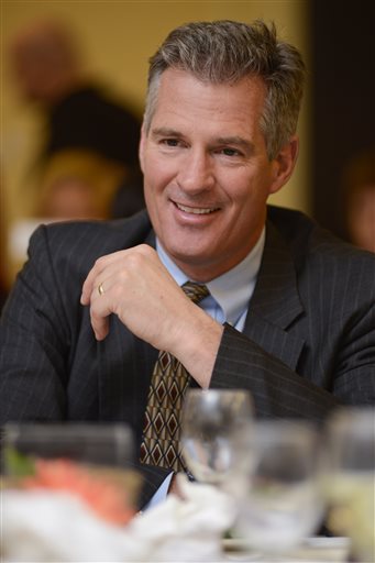 Former U.S. Sen. Scott Brown of Massachusetts appears at the annual "Keeping the Dream Alive" dinner commemorating the anniversary of Martin Luther King Jr.'s death on Thursday in Nashua, N.H.