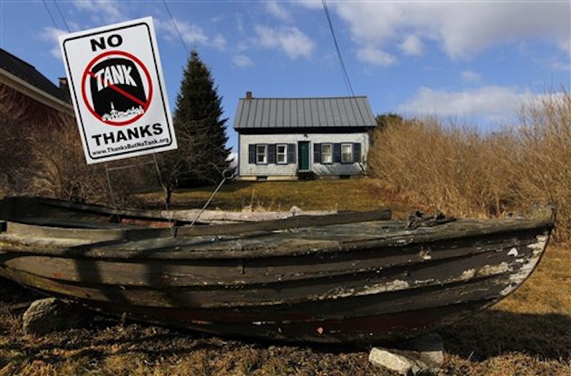 In this Friday, March 9, 2012 photo, a sign in opposition to a proposed 23-million gallon propane tank is seen in the front yard of a home in Searsport, Maine. (AP Photo/Robert F. Bukaty)