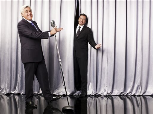 This undated promotional image released by NBC shows Jay Leno, host of "The Tonight Show with Jay Leno," left, and Jimmy Fallon, host of "Late Night with Jimmy Fallon," in Los Angeles.
