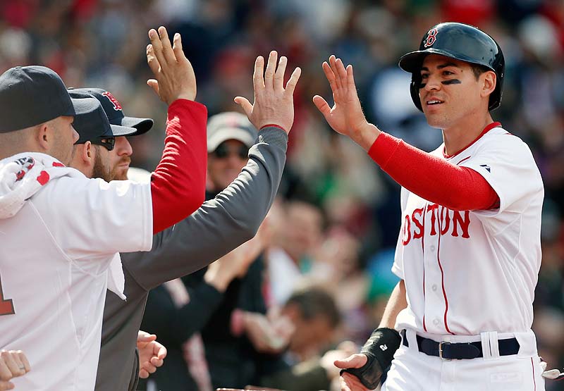 Jacoby Ellsbury, right, celebrates after scoring on an RBI single by David Ortiz in the sixth inning Saturday at Fenway Park.