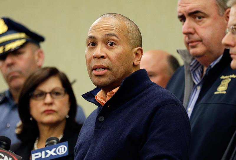 Massachusetts Gov. Deval Patrick speaks as Boston Police Commissioner Ed Davis, middle, and FBI Special Agent in Charge Richard DesLauriers, far right, listen at a news conference in Boston Monday, April 15, 2013 regarding two bombs which exploded in the street near the finish line of the Boston Marathon on Monday, killing three people and injuring more than 130. (AP Photo/Elise Amendola)