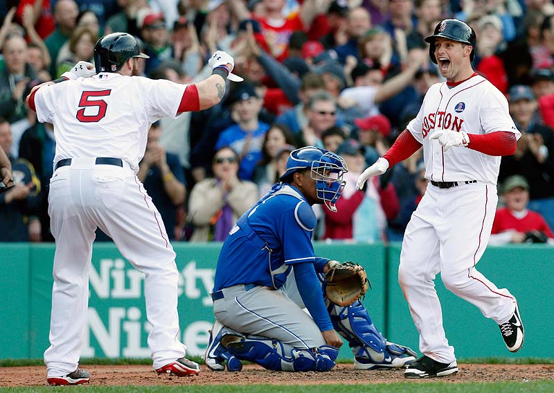 Daniel Nava, right, celebrates his three-run home run with Jonny Gomes as Kansas City catcher Salvador Perez looks on in the eighth inning Saturday at Fenway Park. The Red Sox won 4-3.