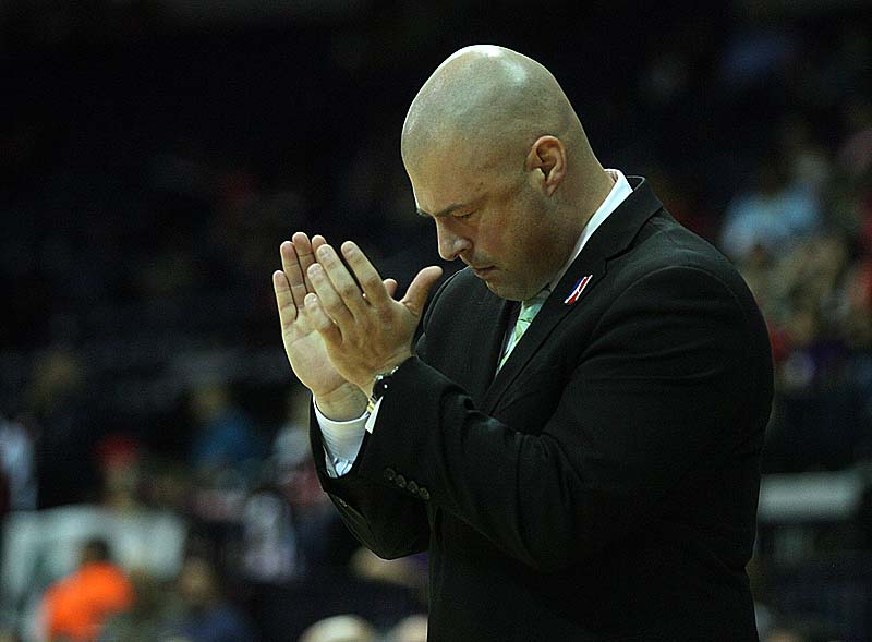Claws Coach Mike Taylor cheers on the team in Saturday night's layoff game. The Claws were ousted by the Vipers, 98-97.