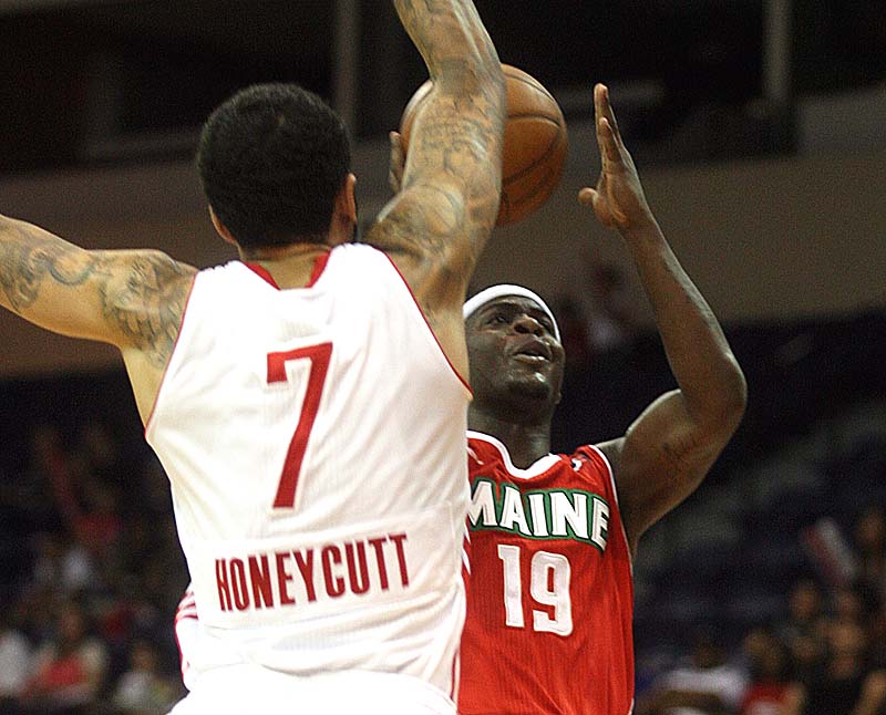 Josh Selby of the Maine Red Claws takes the ball to the basket Saturday night against Tyler Honeycutt of the Rio Grande Valley Vipers. The Claws were eliminated, 98-97.