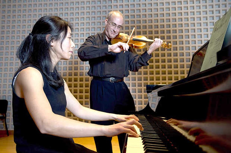 Pianist Chiharu Naruse and violinist Dean Stein perform on Friday at the Olin Arts Center on the campus of Bates College in Lewiston. bates college lewiston maine