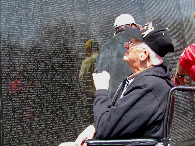 Richard Leighton of Westbrook stares up at the name of his brother, Sgt. Raymond Leighton, engraved on the Vietnam Veterans Memorial in Washington, D.C., on Sunday. Leighton, who is terminally ill with cancer, was able to visit the memorial for the first time with Honor Flight New England, a nonprofit that flies veterans of World War II and other terminally ill veterans to Washington for free.