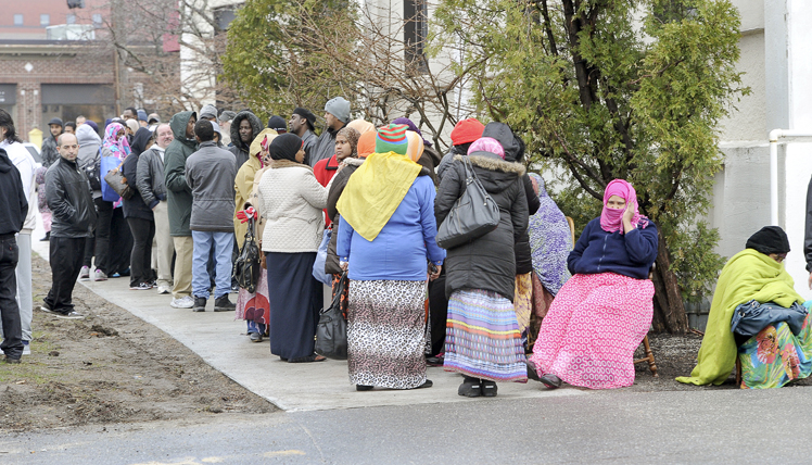 Hundreds of people line up at the Portland Housing Authority on Baxter Boulevard on Wednesday morning. Some waited in line 24 hours because the authority opened its Section 8 waiting list for the first time in three years.