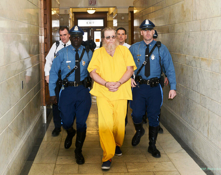 Massachusetts State Troopers lead convicted rapist Gary Irving into the Norfolk District Courthouse in Dedham on April 1 for his first court appearance in Massachusetts since his capture in Gorham, Maine, on March 27.