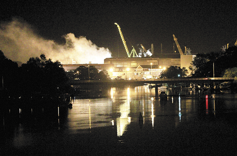 Smoke rises from a Portsmouth Naval Shipyard dry dock as fire crews respond Wednesday, May 23, 2012 to a fire on the USS Miami SSN 755 submarine at the Portsmouth Naval Shipyard on an island in Kittery, N.H. Four people were injured. (AP Photo/The Herald, Ionna Raptis)