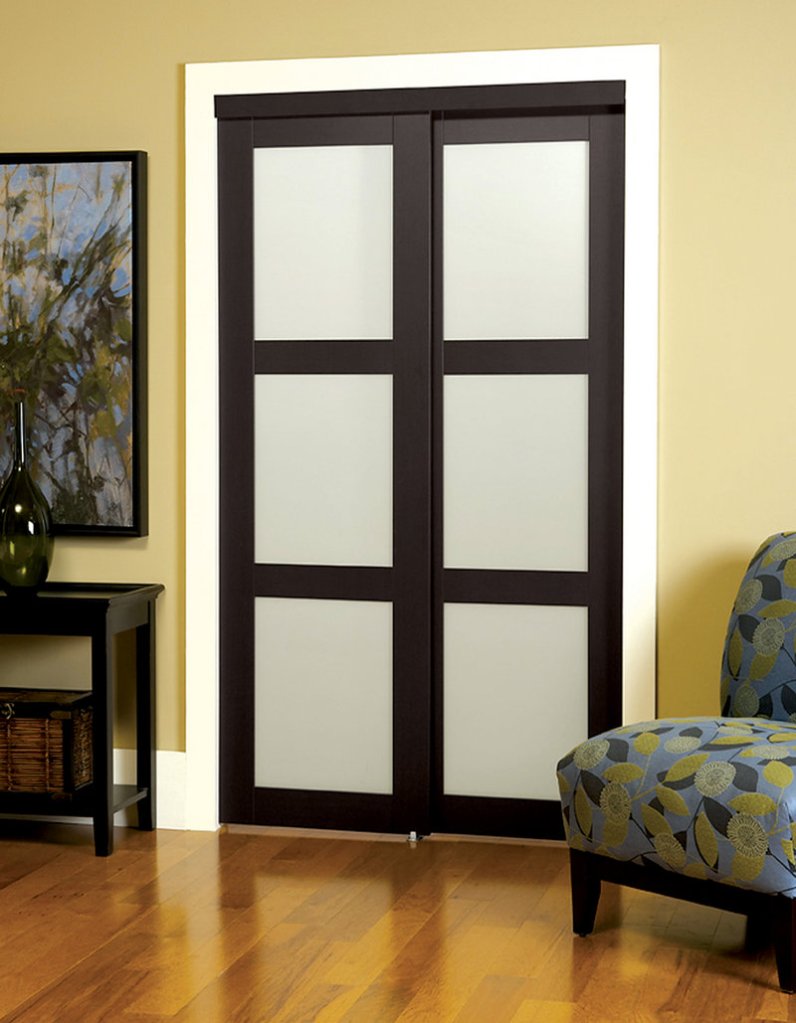 An interior sliding door from Lowe’s with tempered frosted glass panes.