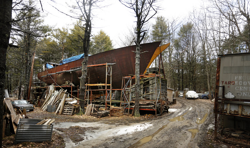 The Island Rover dominates the property of Harold Arndt on Bucknam Road in Freeport. The still-unfinished schooner has been assembled from scrap metal and recycled material.