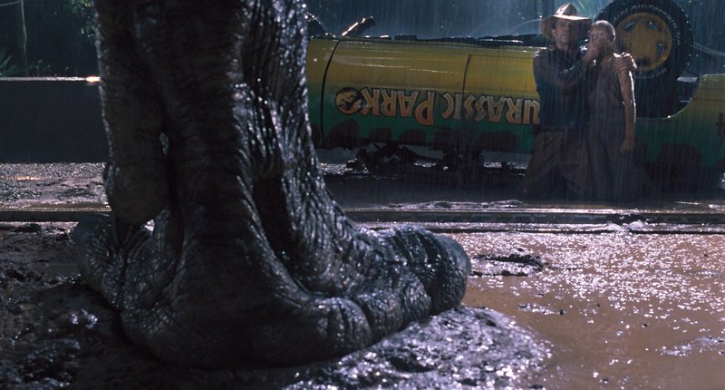 Sam Neill and Joseph Mazzello hide in plain sight from a Tyrannosaurus in “Jurassic Park 3D.”