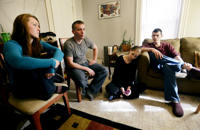 Aunts and uncles of Kitty McGuire talk about their 13-year-old niece, who took her life last month in Troy. From left, Bobbi Pelletier and Michael McGuire join Hannah and Timothy McGuire at the couple's home in Bangor. They hope that when police obtain access to Kitty's messages on her iPod, it may yield some answer to the mystery of what triggered her suicide.