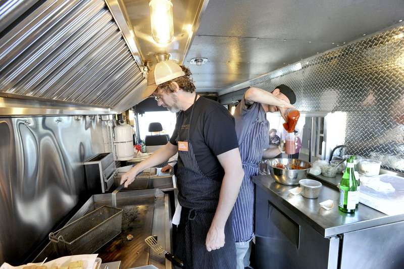 Chefs Rob Evans and Karl Deuben in the Good Shepherd Food-Bank’s new food truck.
