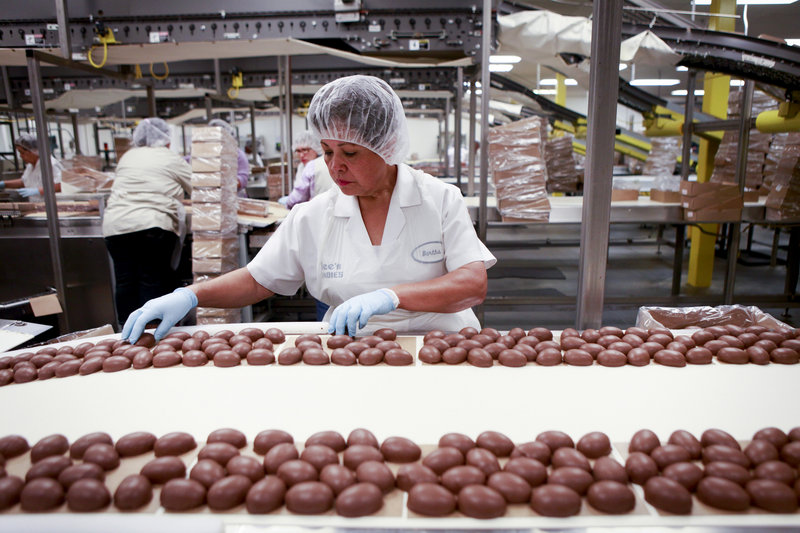 Bertha Ramos sorts freshly coated chocolate marshmallow eggs at a See’s Candies factory in Los Angeles.