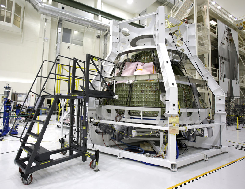 The Orion Exploration Flight Test 1 crew module is seen in the Operations and Checkout Building at the Kennedy Space Center in Cape Canaveral, Fla., during a media tour earlier this year.