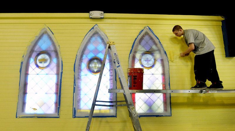 Russell Brown 16, of YouthBuild Biddeford, paints the interior of YouthBuild Biddeford (formerly Christ Episcopal Church) on Tuesday, April 9, 2013.