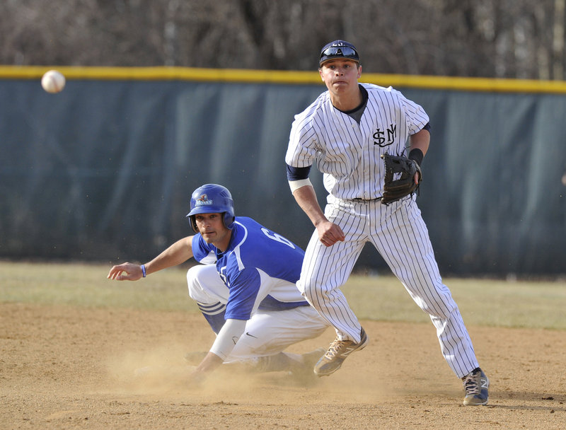 Sam Dexter of Southern Maine watches the ball heading to first base Tuesday, completing a double play after forcing Sam Butts of St. Joseph’s at second base. USM improved to 16-3 with a 16-2 victory at home against its rival.