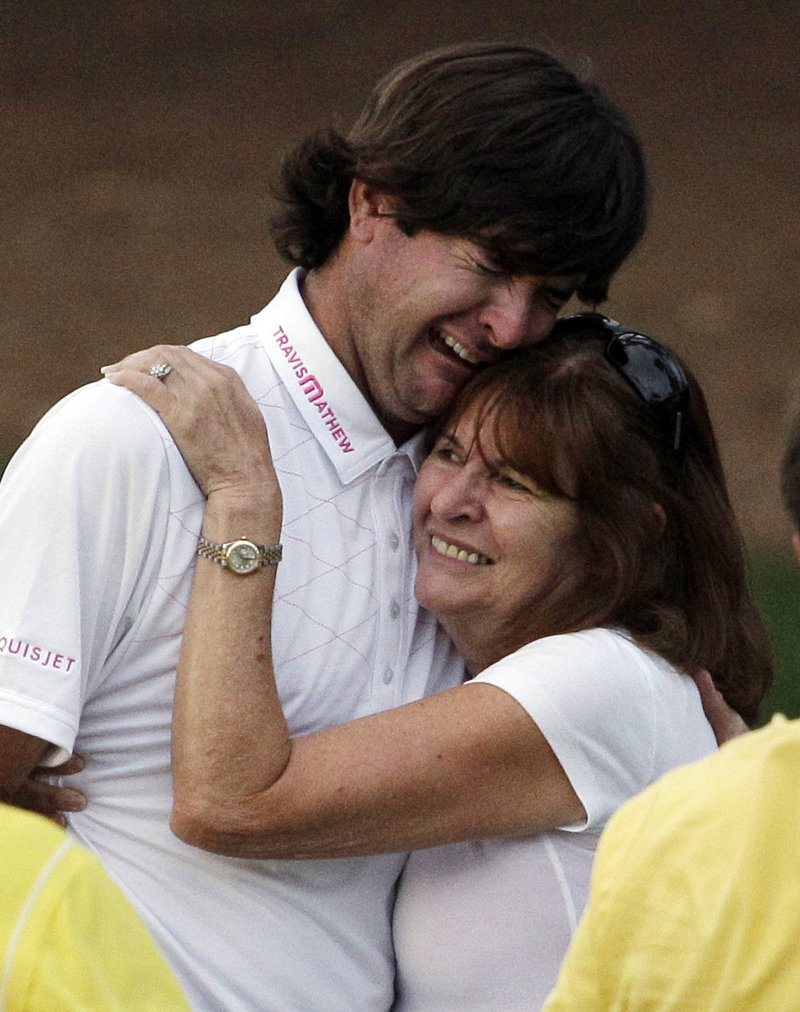 Molly Marie Watson proudly hugs her son, Bubba Watson, after he won the 2012 Masters, partially due to a perfect wedge shot from pine straw on the 10th hole to save par.