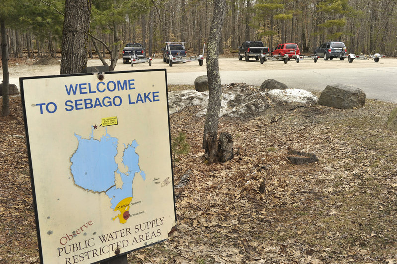 Trucks and trailers sit in the parking lot near the public boat launch at Sebago Lake, and those vehicles will soon increase in number.