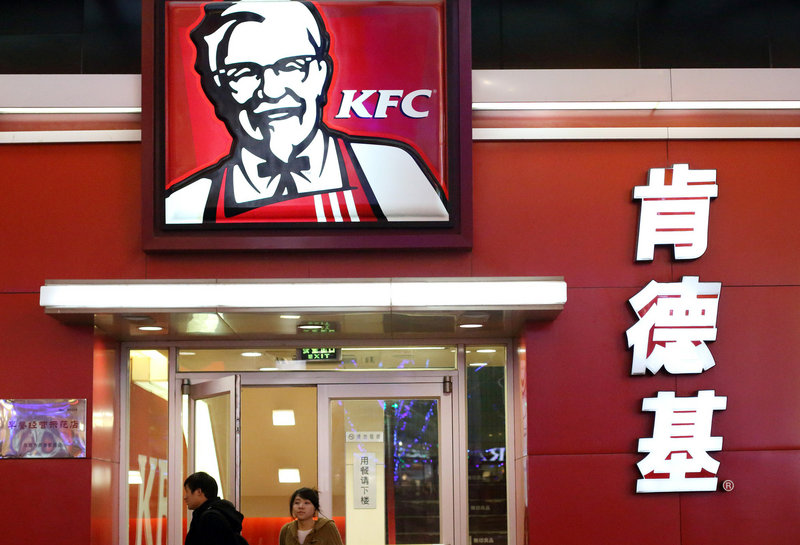 A couple leave a KFC outlet in Beijing. Health experts say the proliferation of fast-food restaurants is partly to blame for increases in heart diseases and diabetes in China and other countries.