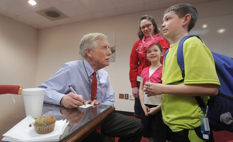 Nathan Little, 10, of Lewiston, who was visiting Washington with his mother, Jackie, and 8-year-old sister, Kristen, reacts Wednesday after Sen. Angus King asks him what kind of work senators do. King wrote a note for his teacher, explaining that Nathan should be excused from school since he was helping King with his work in Washington.