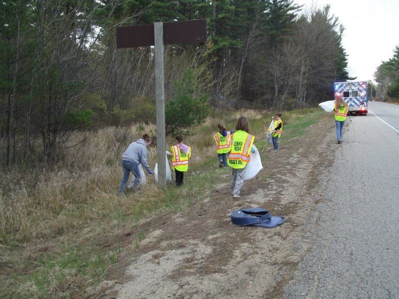 Lebanon Girl Scouts pick up litter beside the Carl Broggi Highway during the 2012 Lebanon Pride Day. This year’s cleanup event is Saturday.