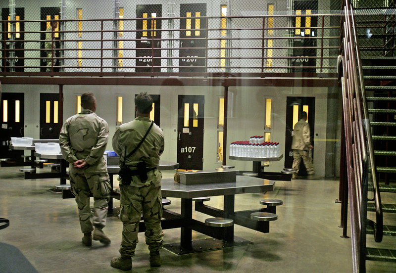 Guards keep watch over a cell block with detainees in the Camp 6 maximum-security facility at Guantanamo Bay U.S. Naval Base, Cuba, in this 2007 photo.