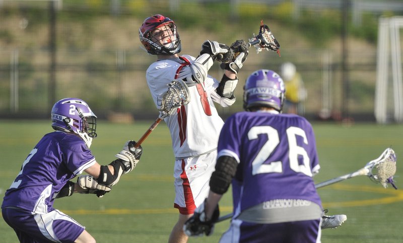 Scarborough’s John Wheeler leaps over the Marshwood defense to score one of his Class A-leading 51 goals last season. Back for his senior year, Wheeler is one reason the perennial powerhouse Red Storm are talking about a fourth consecutive championship. Wheeler, an All American selection, had 31 assists last year.