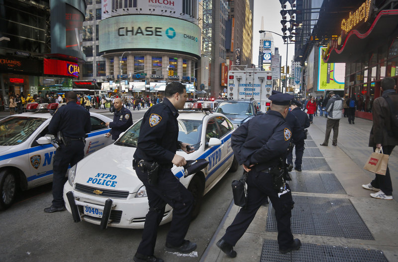 Police monitor New York’s Times Square as security in the city was stepped up following the explosions at the finish line of the 2013 Boston Marathon on Monday.