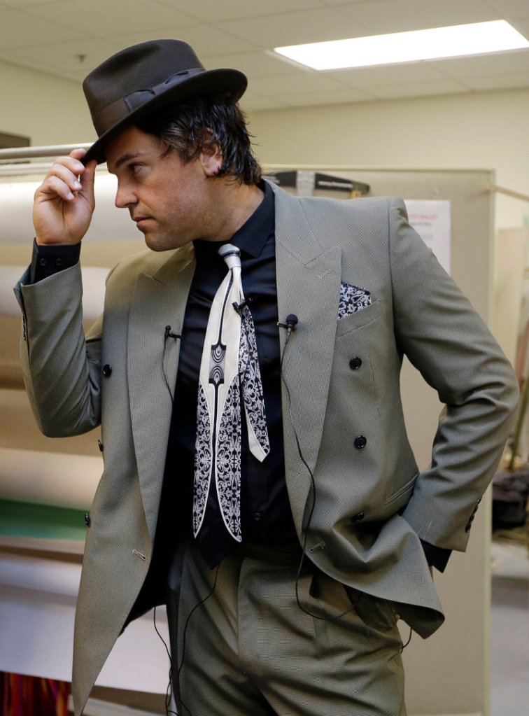 Mike Piazza strikes a pose as he is fitted for his costume for his role in “Slaughter on Tenth Avenue” in Miami Beach.