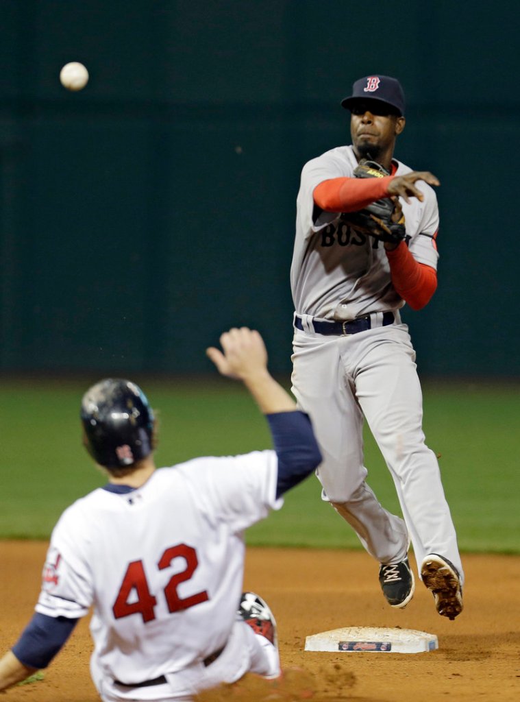 Pedro Ciriaco of the Boston Red Sox fires over Mark Reynolds of the Cleveland Indians to complete a double play in the eighth inning Tuesday night. Boston won, 7-2.