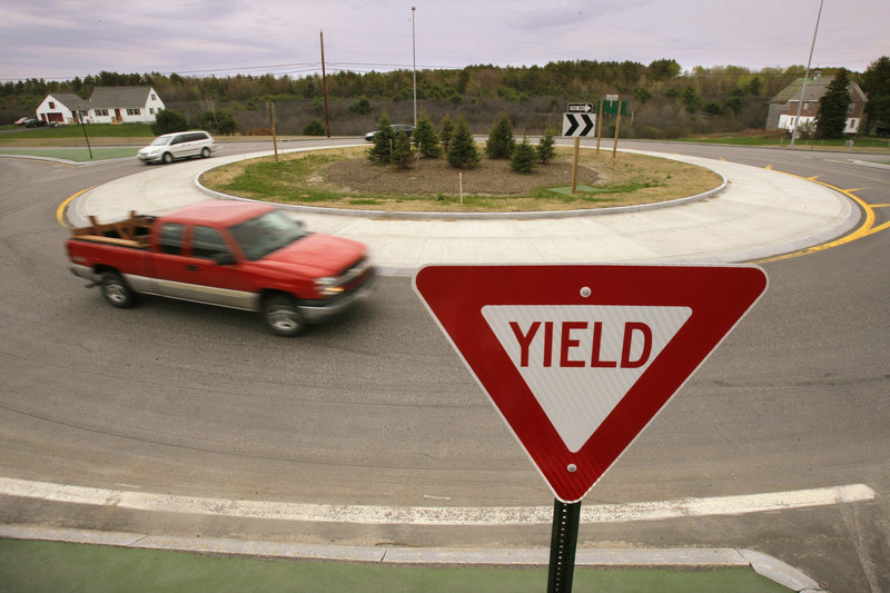 In this May 2009 file photo, cars pass through a roundabout along the Gorham bypass at the junction of Route 114. Roundabouts, which are smaller, slower and thus safer than rotaries, are the way to go, experts say.
