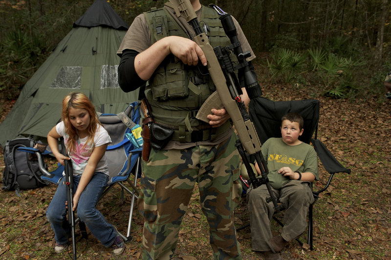 Members of the North Florida Survival Group are seen prior to a field training exercise in Old Town, Florida. The group is a staunch supporter of the right to bear arms and aims to teach “patriots to survive in order to protect and defend our Constitution against all enemy threats.”