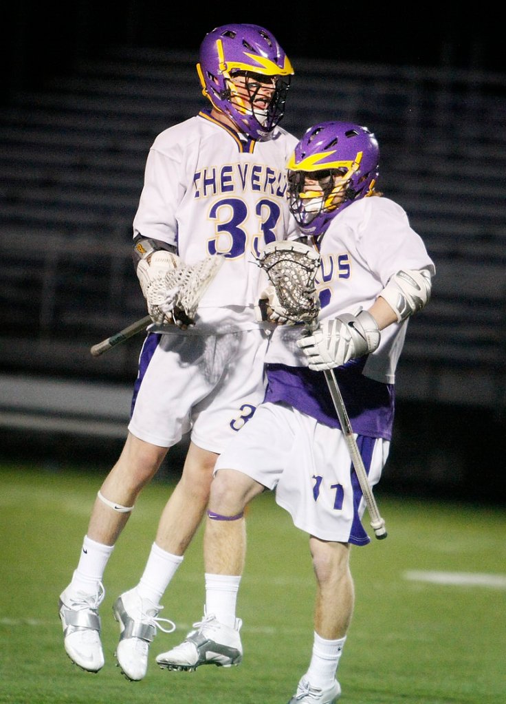 Patrick Sullivan, left, and Jack Sutton of Cheverus celebrate Sutton’s goal in the first quarter. Cheverus led 3-0 at halftime, Thornton rallied to tie, then Cheverus regained control.