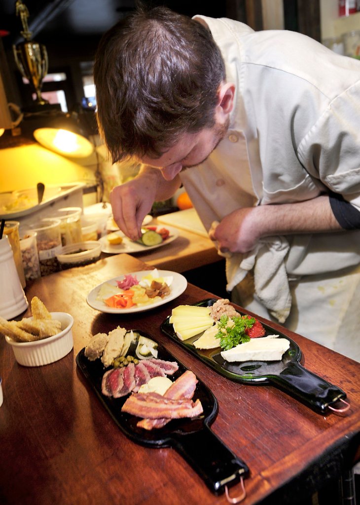 Line chef Kevin Heenan prepares the platters, which are offered on the pub menu. The restaurant also offers a dinner menu.