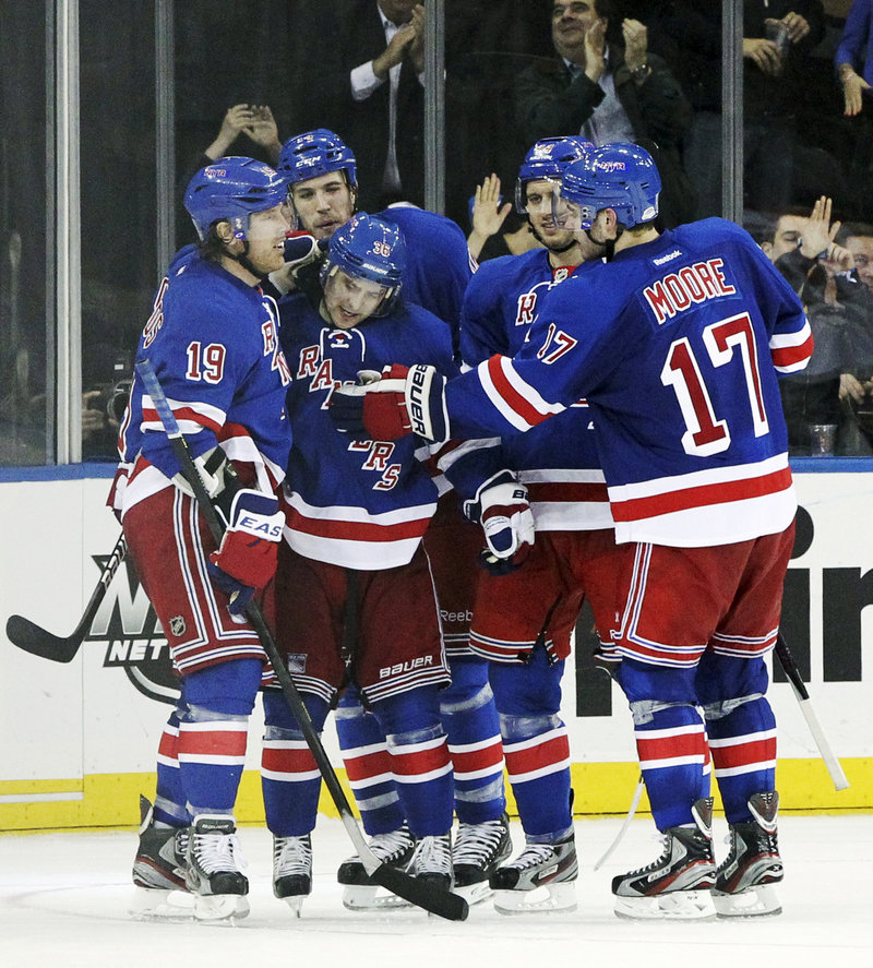 Mats Zuccarello, second from right, is congratulated by his Rangers teammates after a third-period goal during New York’s 6-1 rout of Florida on Thursday night.