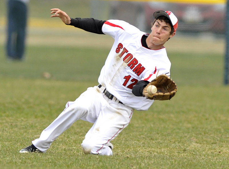 Center fielder Greg Viola of Scarborough makes a sliding catch of a fly ball Friday in the fourth inning of the Red Storm’s 3-0 victory against Thornton Academy.