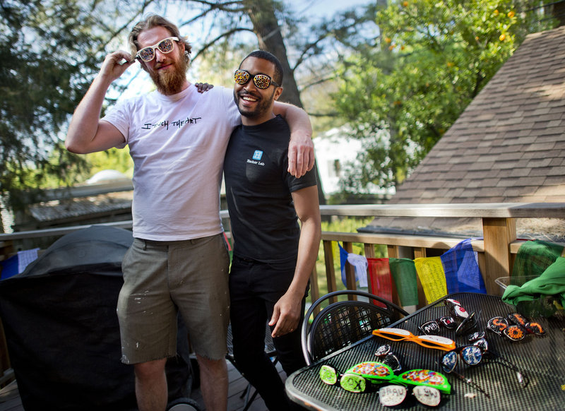 Artist Danny Scheible, left, and his business manager Tre Borden raised $16,000 via crowd funding to make Hacker Glasses. Projects like this one will be able to raise $1 million a year, thanks to a new crowd funding law.