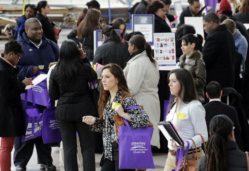Job fairs like this one in New York on March 14 are expected to be the norm by Americans who responded to a poll from The Associated Press.