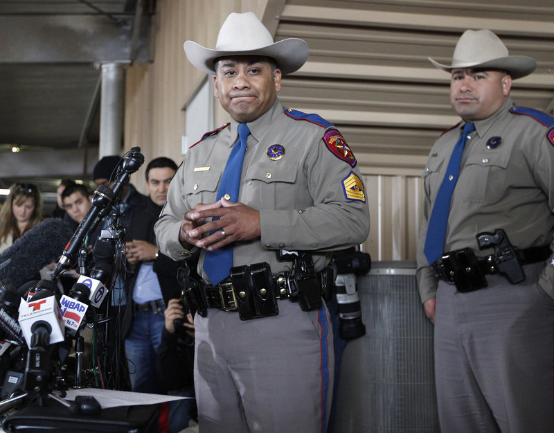 Texas Department of Public Safety Sgt. Jason Reyes, left, and Trooper Noey Fernandez inform reporters of the death toll during a news conference Friday in West, Texas.