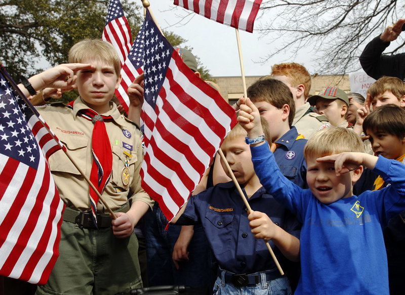 From left, Joshua Kusterer, 12, Nach Mitschke, 6, and Wyatt Mitschke, 4, take part in a “Save Our Scouts” rally at the Boy Scouts of America National Headquarters in Dallas, Texas. The organization announced Friday that it will submit a proposal to lift a ban on homosexuals for members but continue to exclude gays as adult leaders.