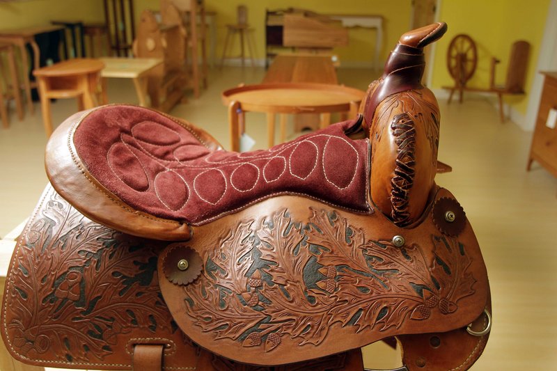 A saddle made by a New Hampshire state prison inmate is seen ready for sale Friday in Franklin, N.H. at the state prison.