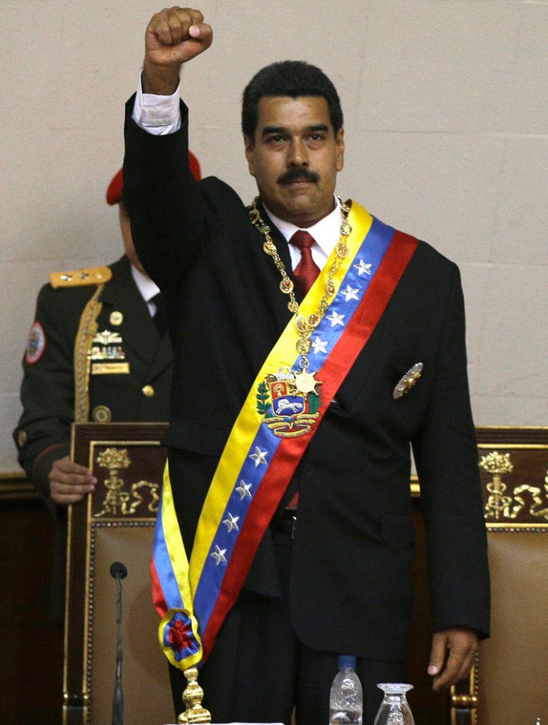 Nicolas Maduro salutes before delivering his inaugural speech at the National Assembly on Friday.