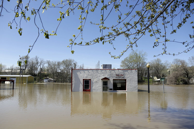 A restaurant is surrounded by floodwater Saturday in Louisiana, Mo. Communities along the Mississippi and other Midwestern rivers are facing “major” and possibly record flooding.