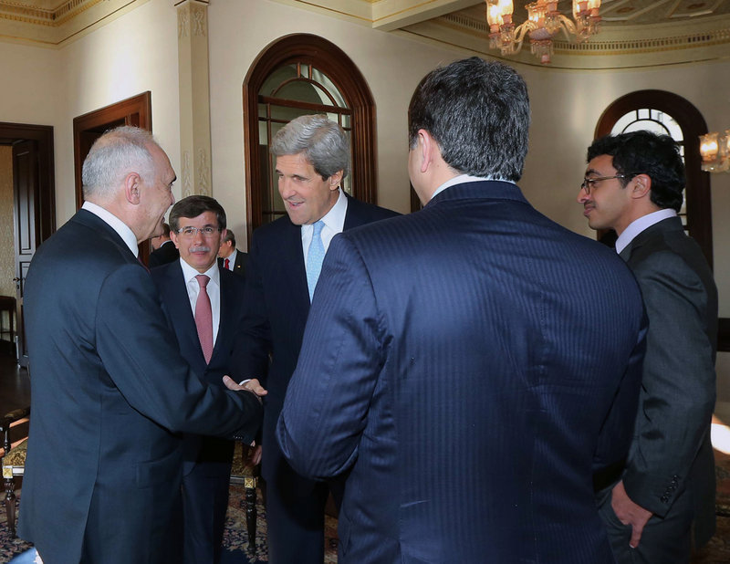 Secretary of State John Kerry, center, and members of the Friends of Syria group meet Saturday in Istanbul. They aimed to increase pressure on the Syrian president to step down.