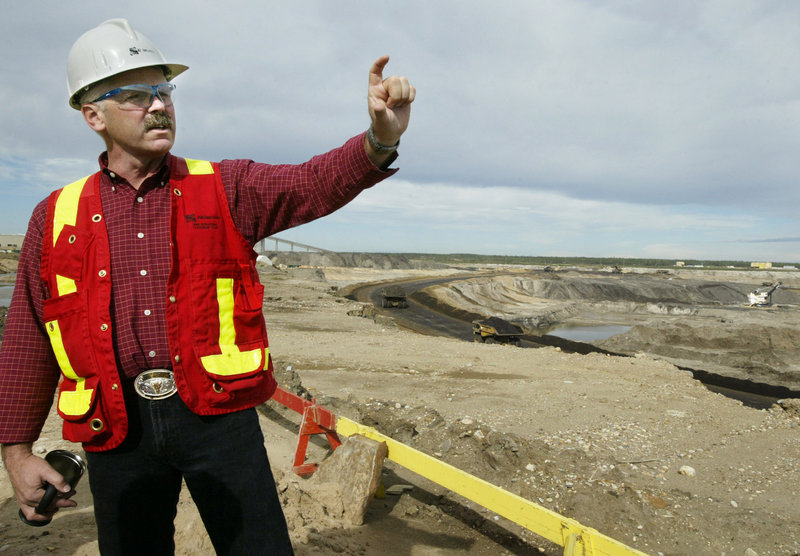 Chris Jones of Albian Sands Energy describes the company's Fort McMurray, Alberta, oil-sands project in 2005. Canada's government, greatly invested in tar sands' success, is pressing for the transmission of tar-sands oil from Montreal to Portland, a reader says.