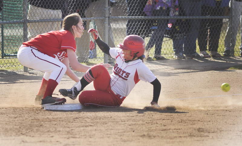 South Portland’s Lorinne Bateman slides into third ahead of the throw to Scarborough’s Maggie Murphy.